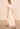 The Ulla Johnson Dani Dress is finished with scallop-edged eyelets and stripe embroidery for texture. Split neck silhouette belts at the waist and falls into a pleated drop skirt.
