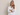 Woman wearing a white shirt against a plain background